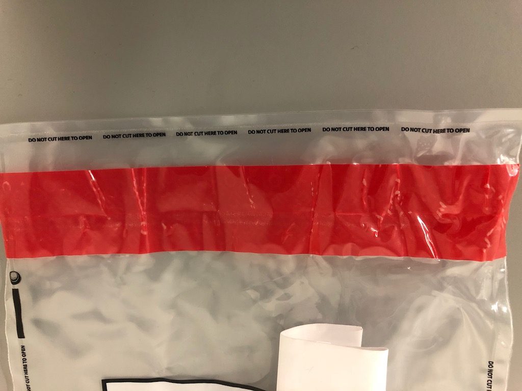 B-Sealed X-Safe clear plastic tamper evident bag with red tamper evident seal