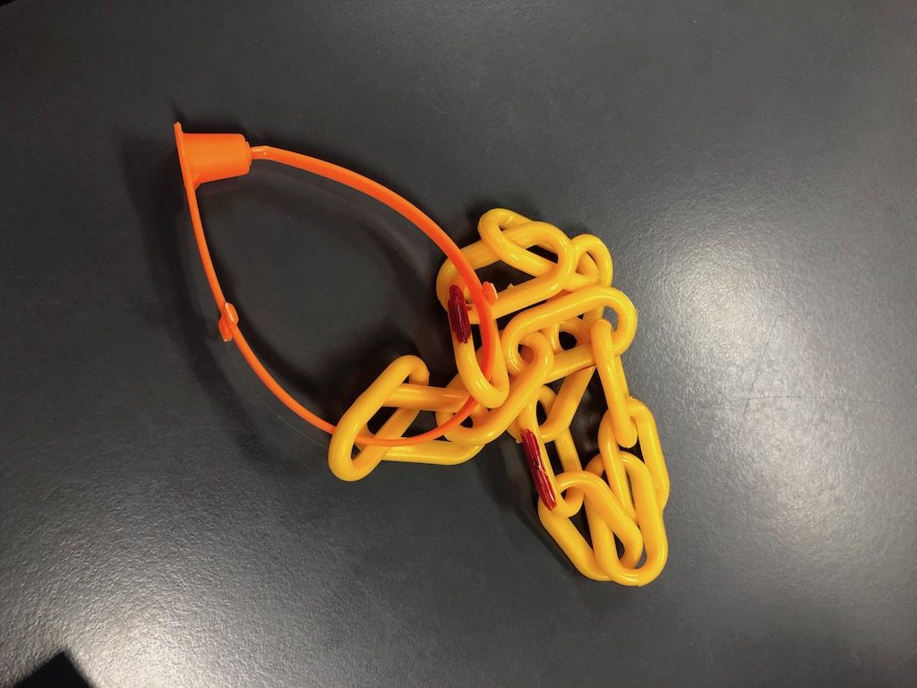Orange B-Sealed EnaTail 2 fixed length seal with yellow plastic chain