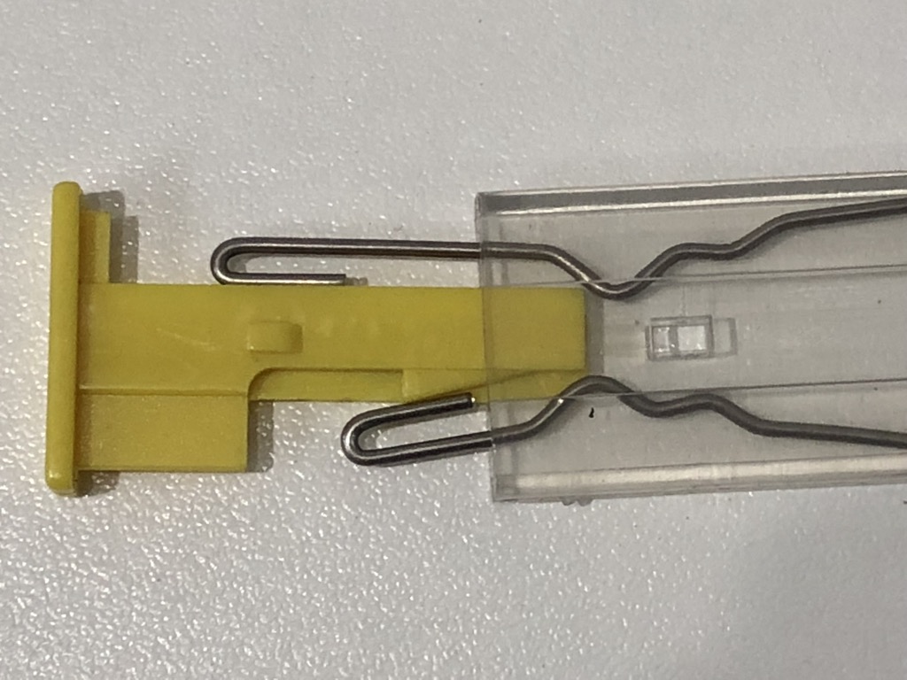EnaShackle 1 with hooks being released to slide centre yellow piece out