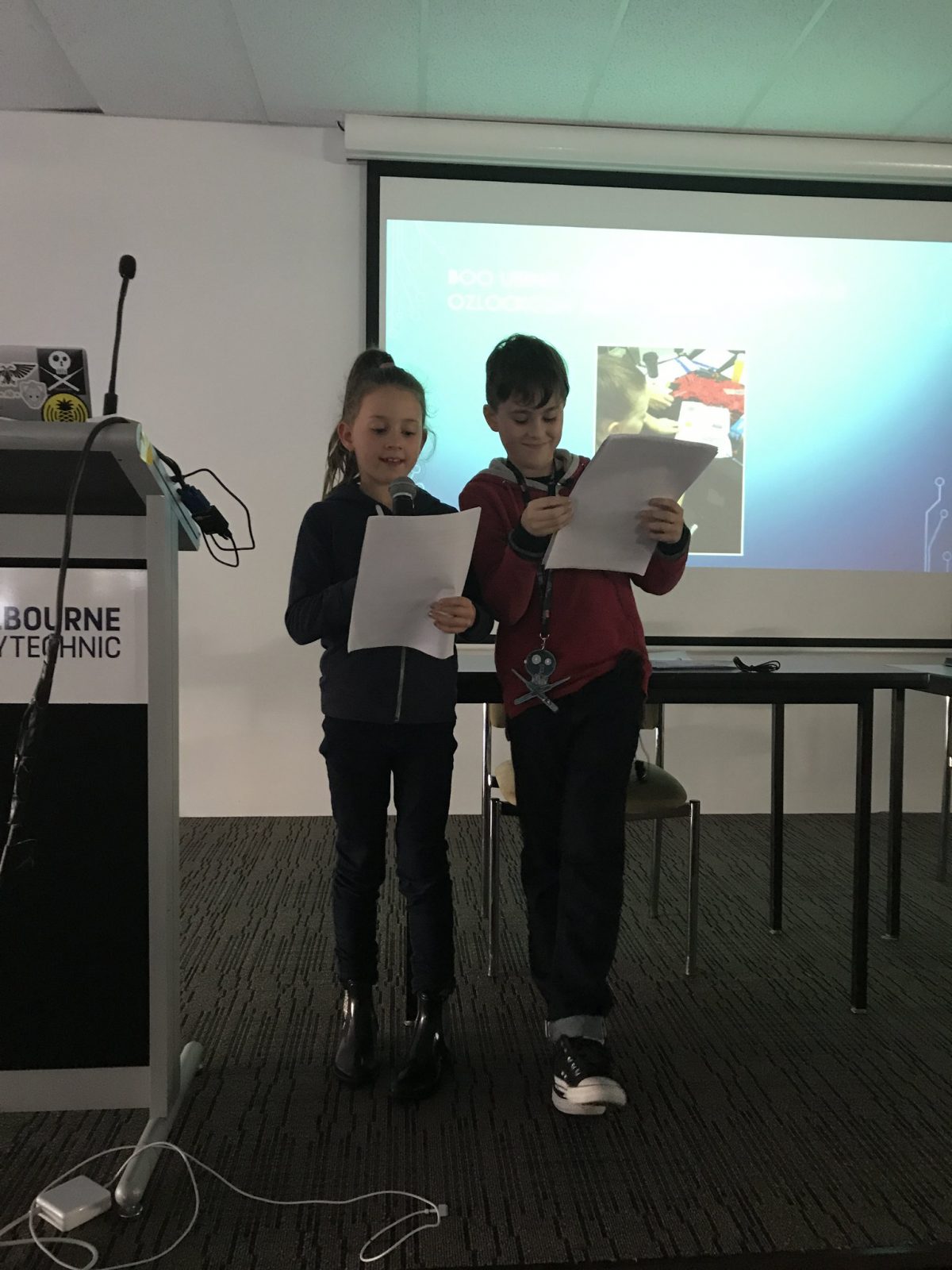photo of mos and boo standing on stage presenting at ozseccon 2018