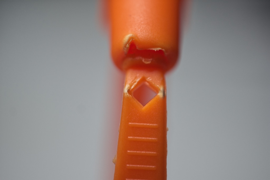 fixed length tamper evident seal showing cutaway used to break seal when done with it