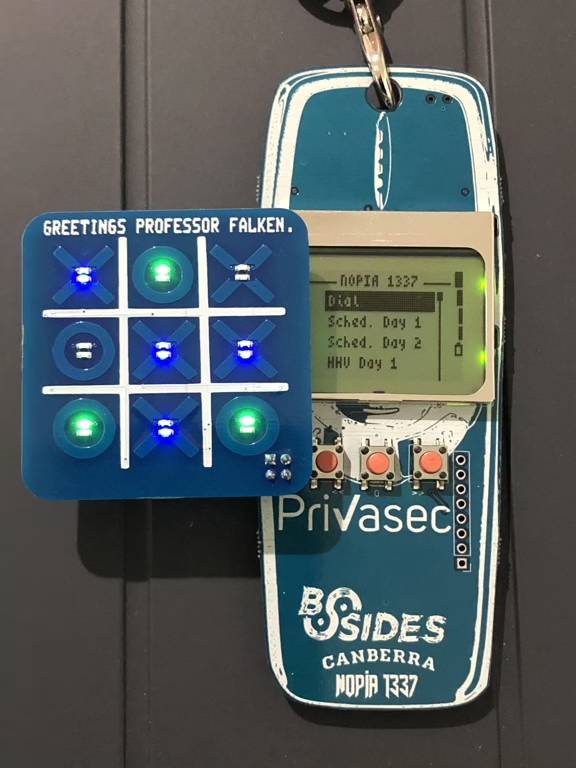 An electronic toc-tac-toe add-on board to the bsides canberra 2019 badge