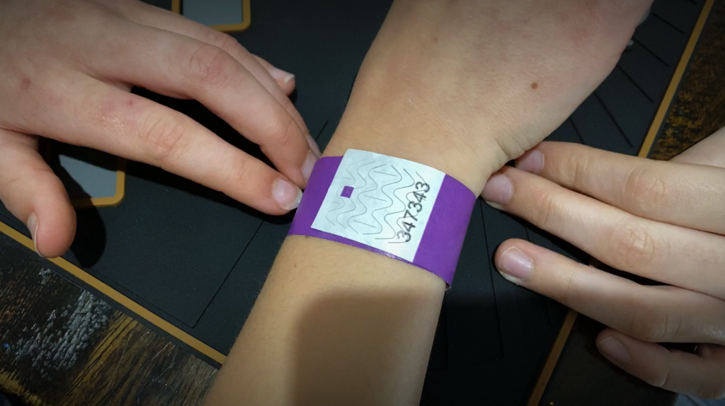 showing the tamper evident wristband after being put back on mos. Not a mark. Looks perfect.