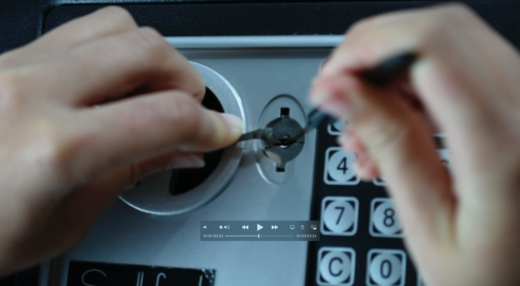 using lock picks to pick the lock on a digital safe
