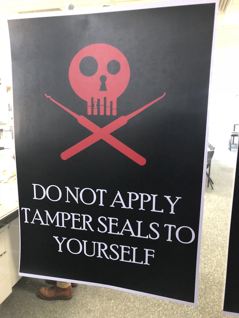 sign saying do not apply tamper seals to yourself from OzSecCon