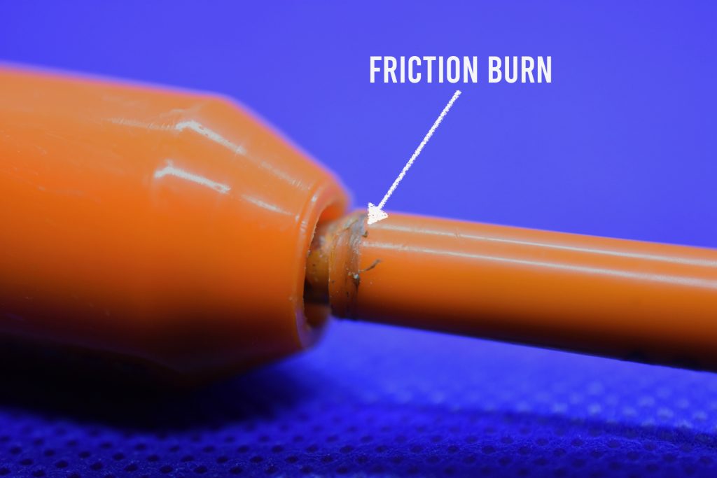 Plastic on bolt seal shaft showing friction burns from spinning attack