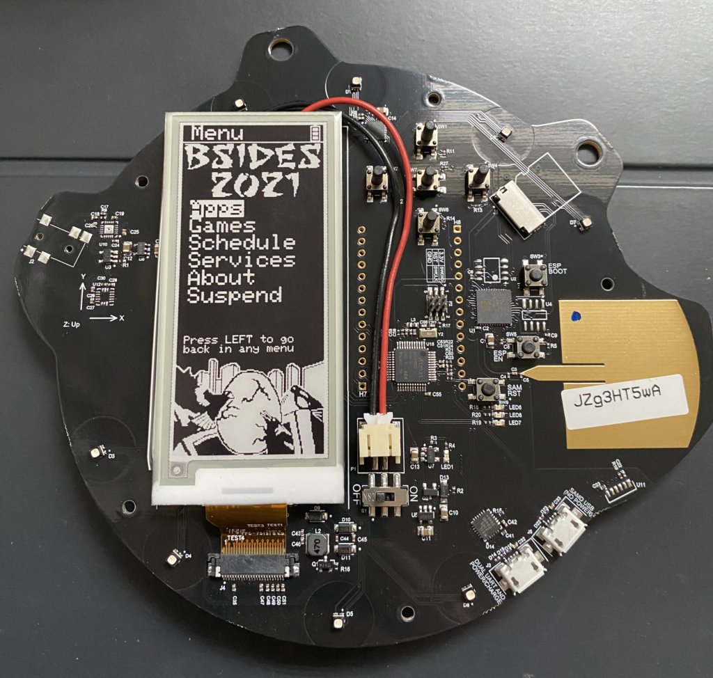 Bsides CBR 2021 badge with cover removed showing circuit board