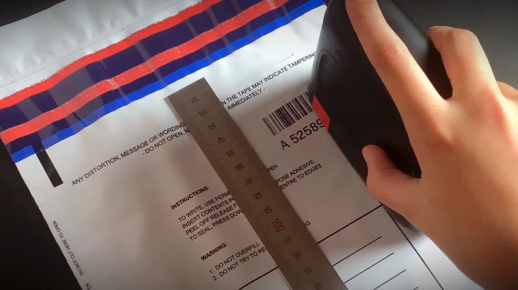 Printing a serial number on a tamper evident security satchel