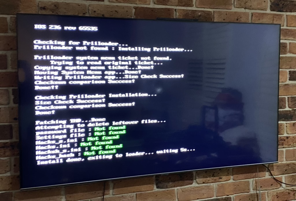 Screen showing Priiloader installing
